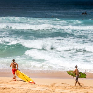 An Oahu lifeguard heading out for a save