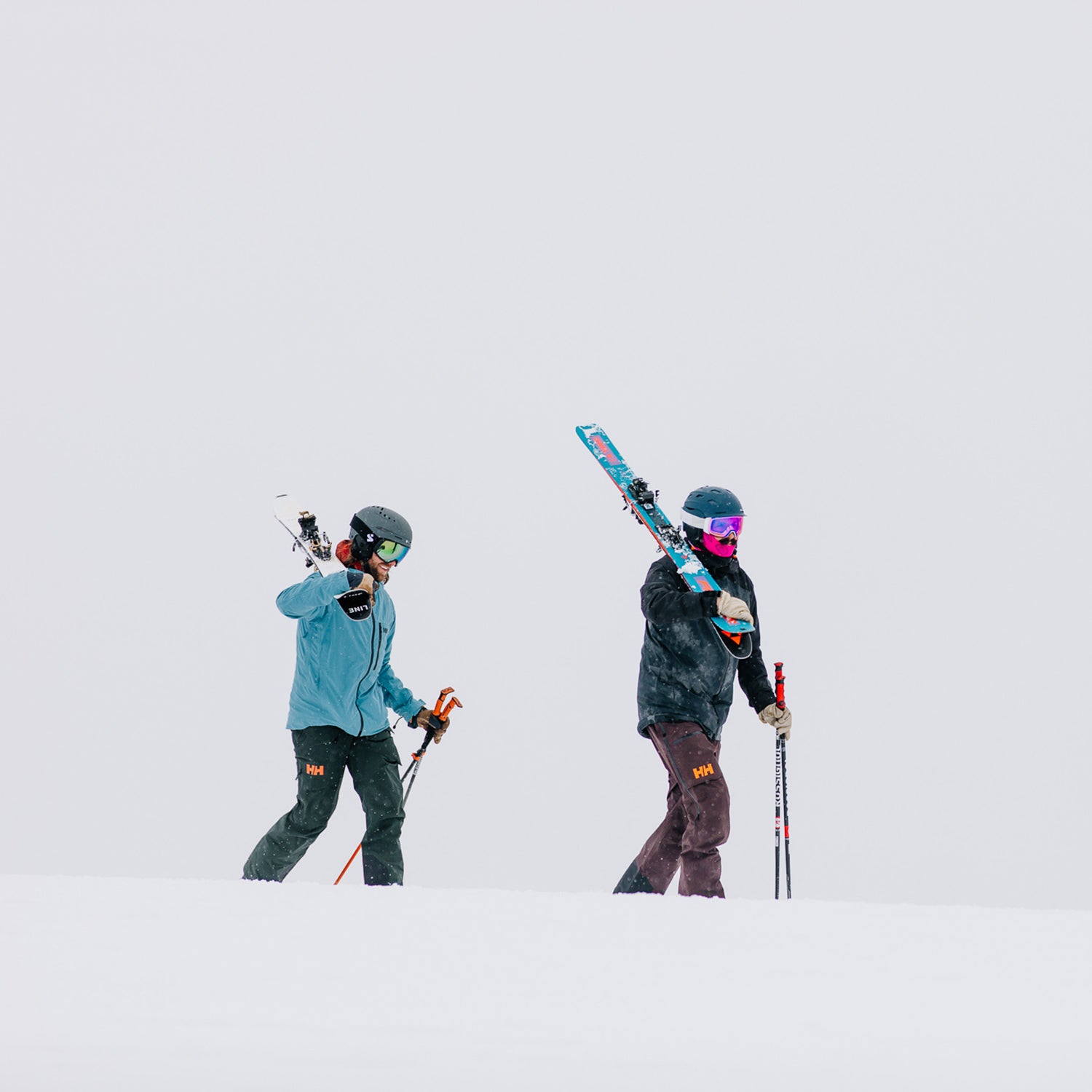 Skiers walking on snow