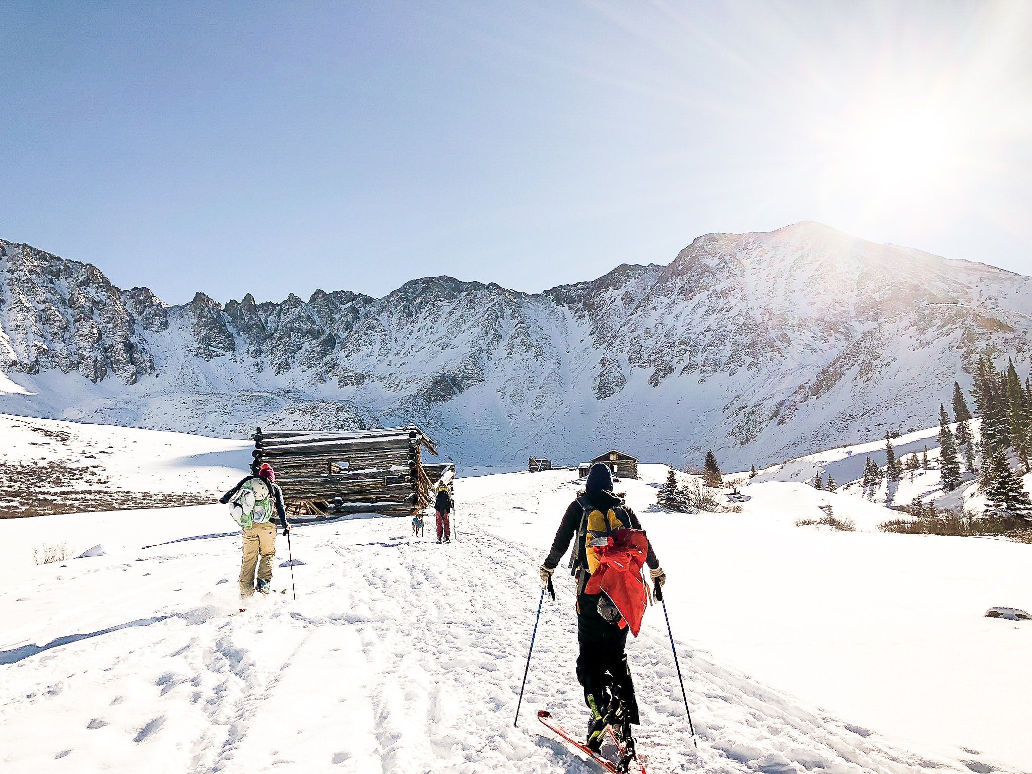 mountains skiers lodge