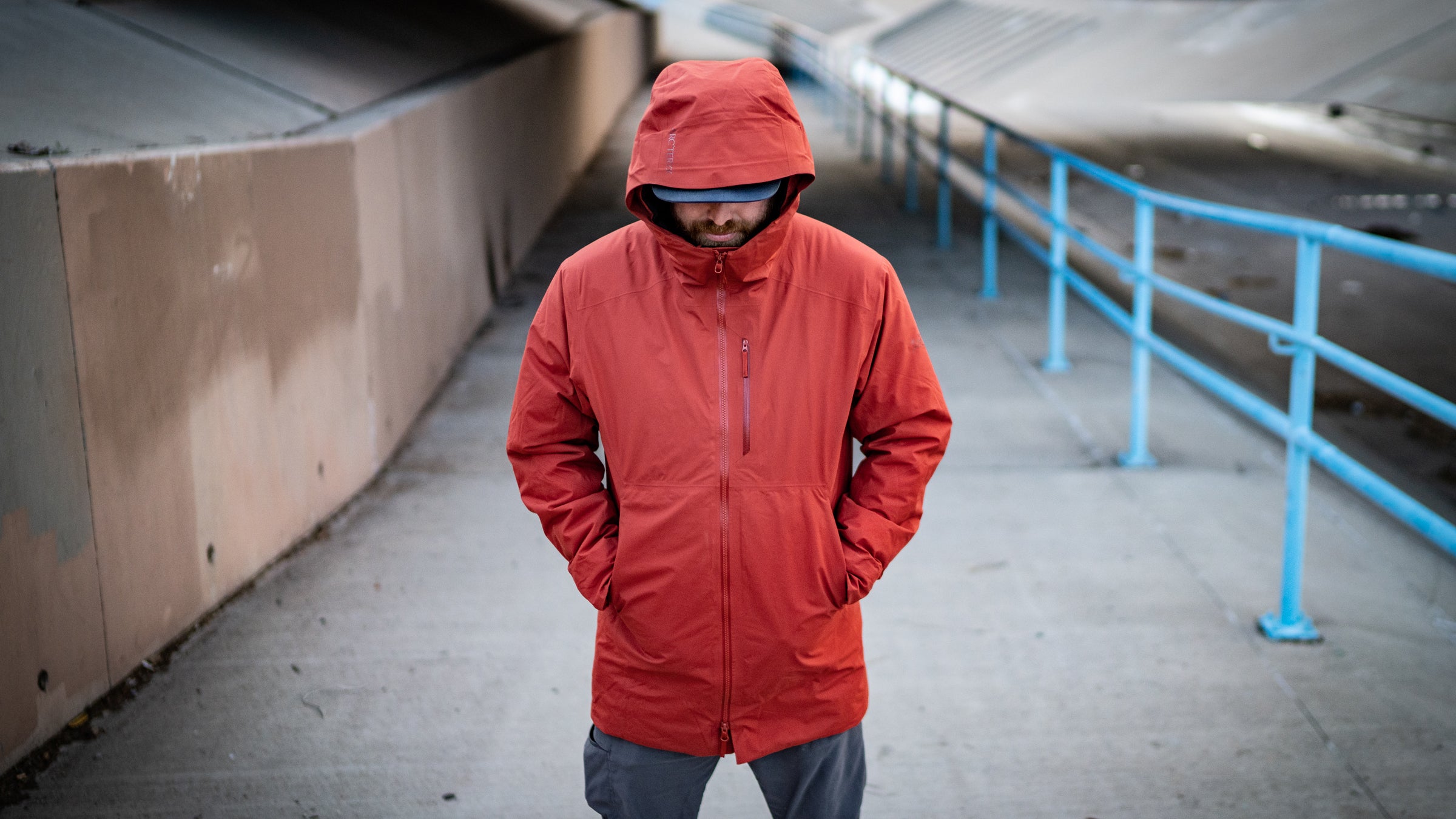 Man standing wearing red parka