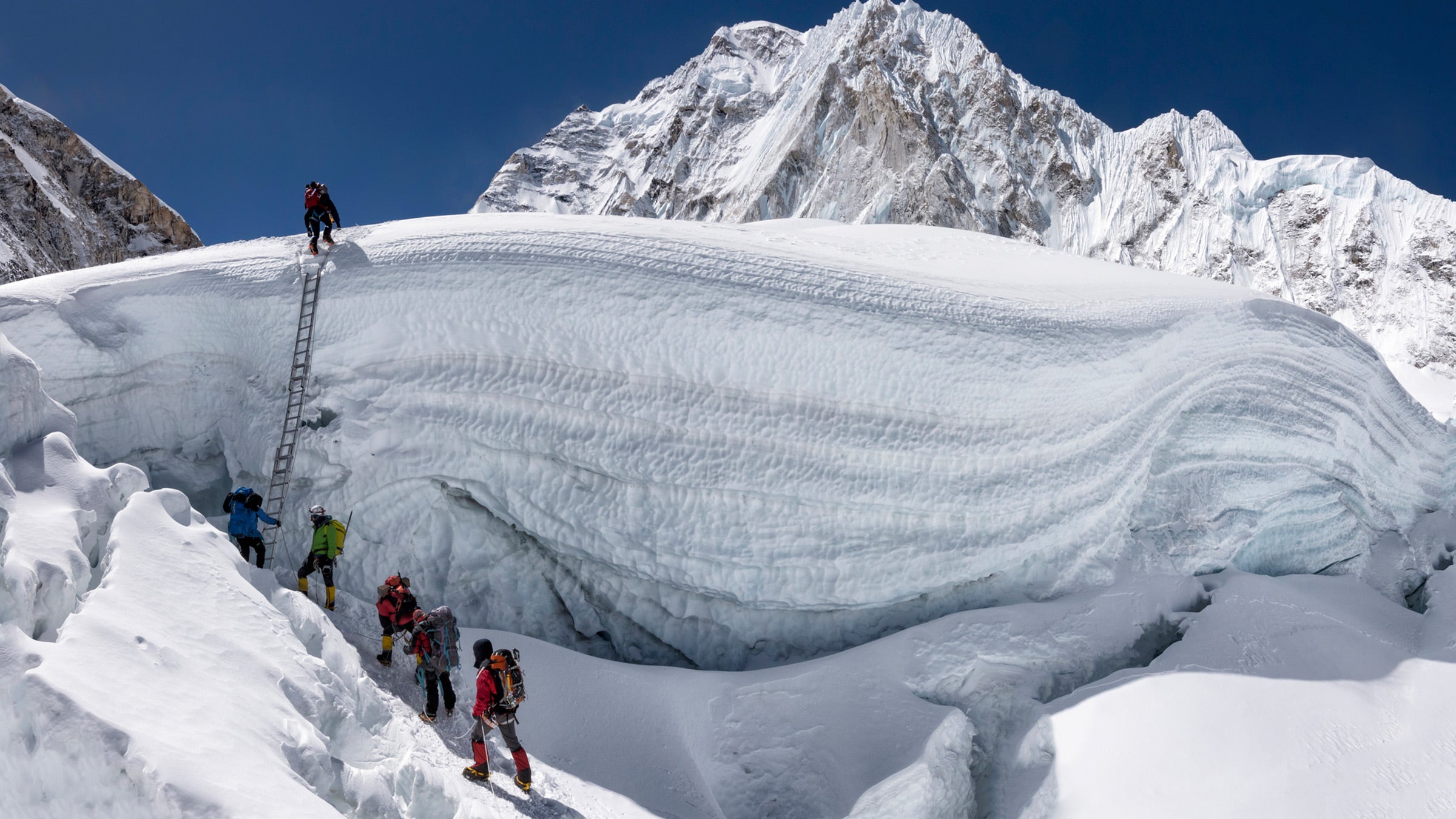 Climbers navigate a glacier on Mount Everest