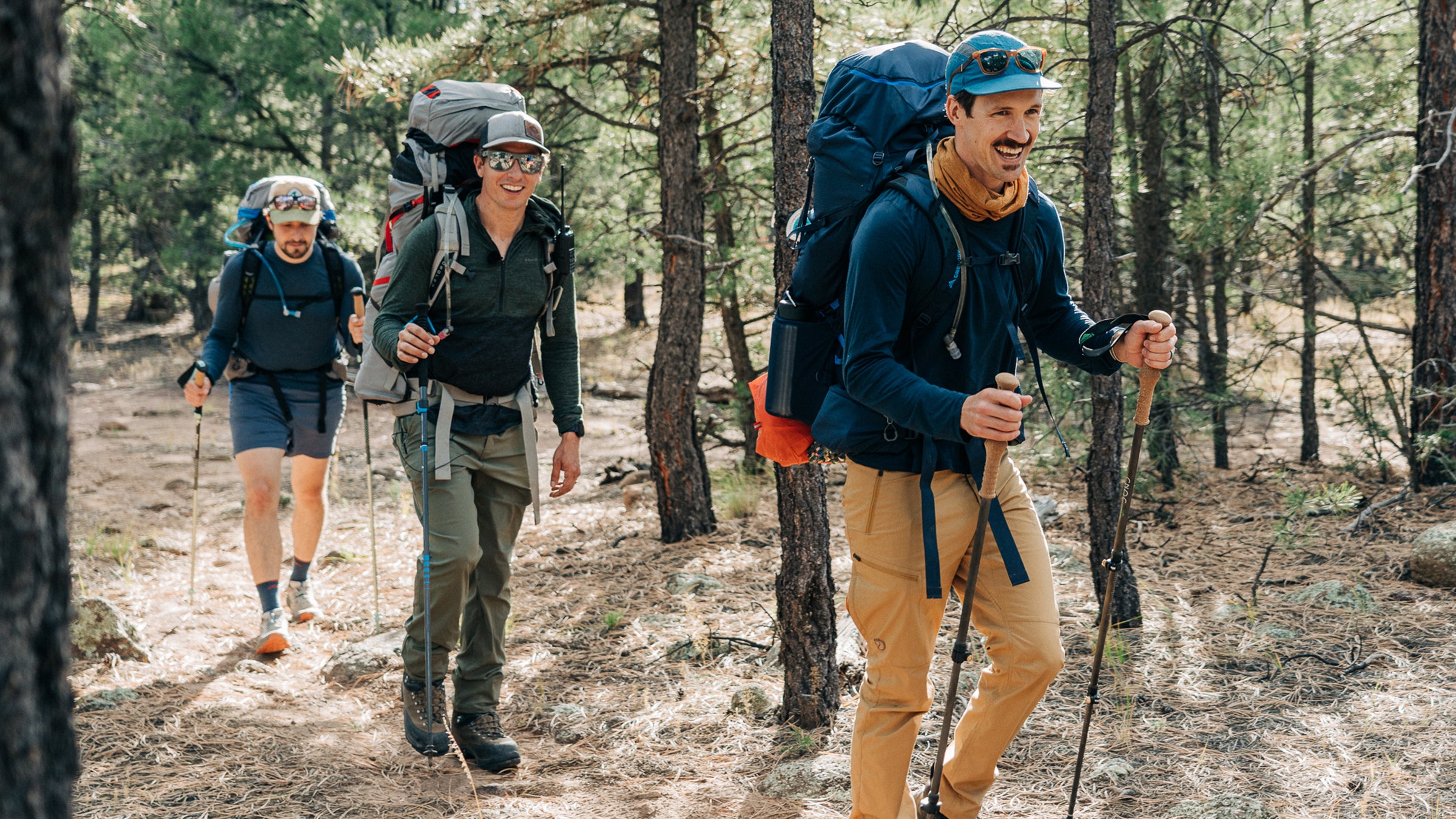 hikers testing backpacking gear on a trail