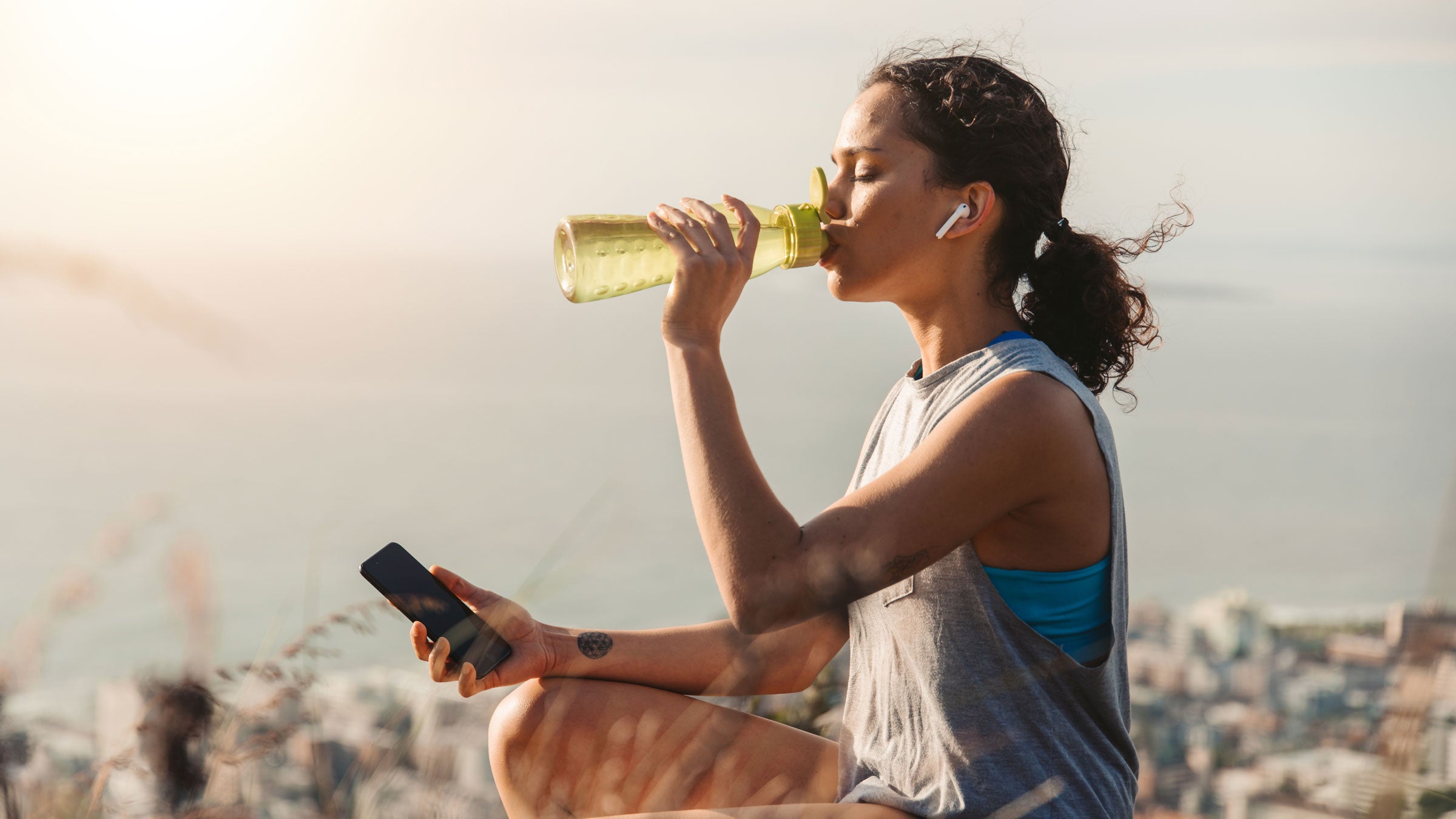Woman consuming electrolyte supplements