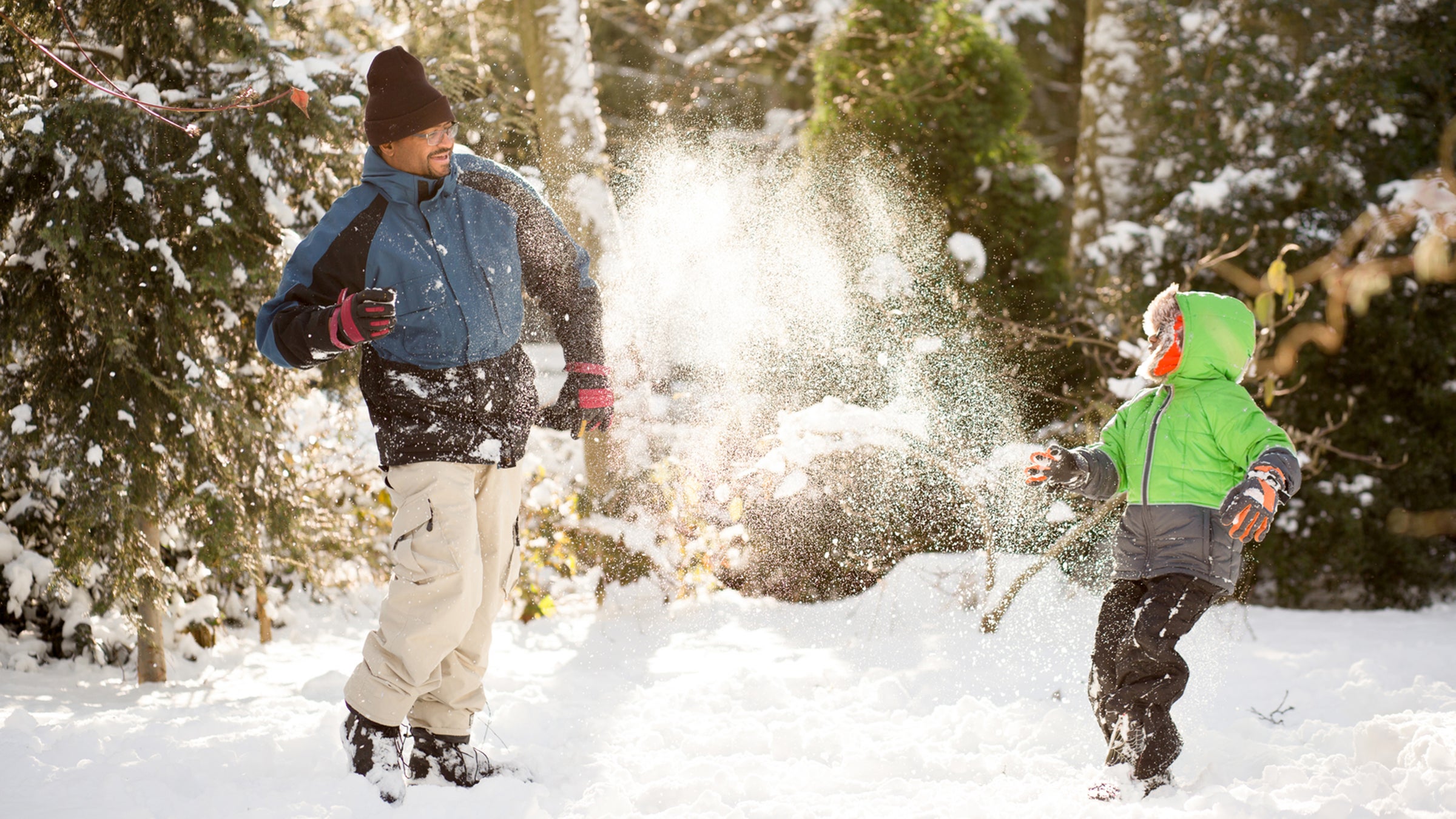 Father and son playing in the snow