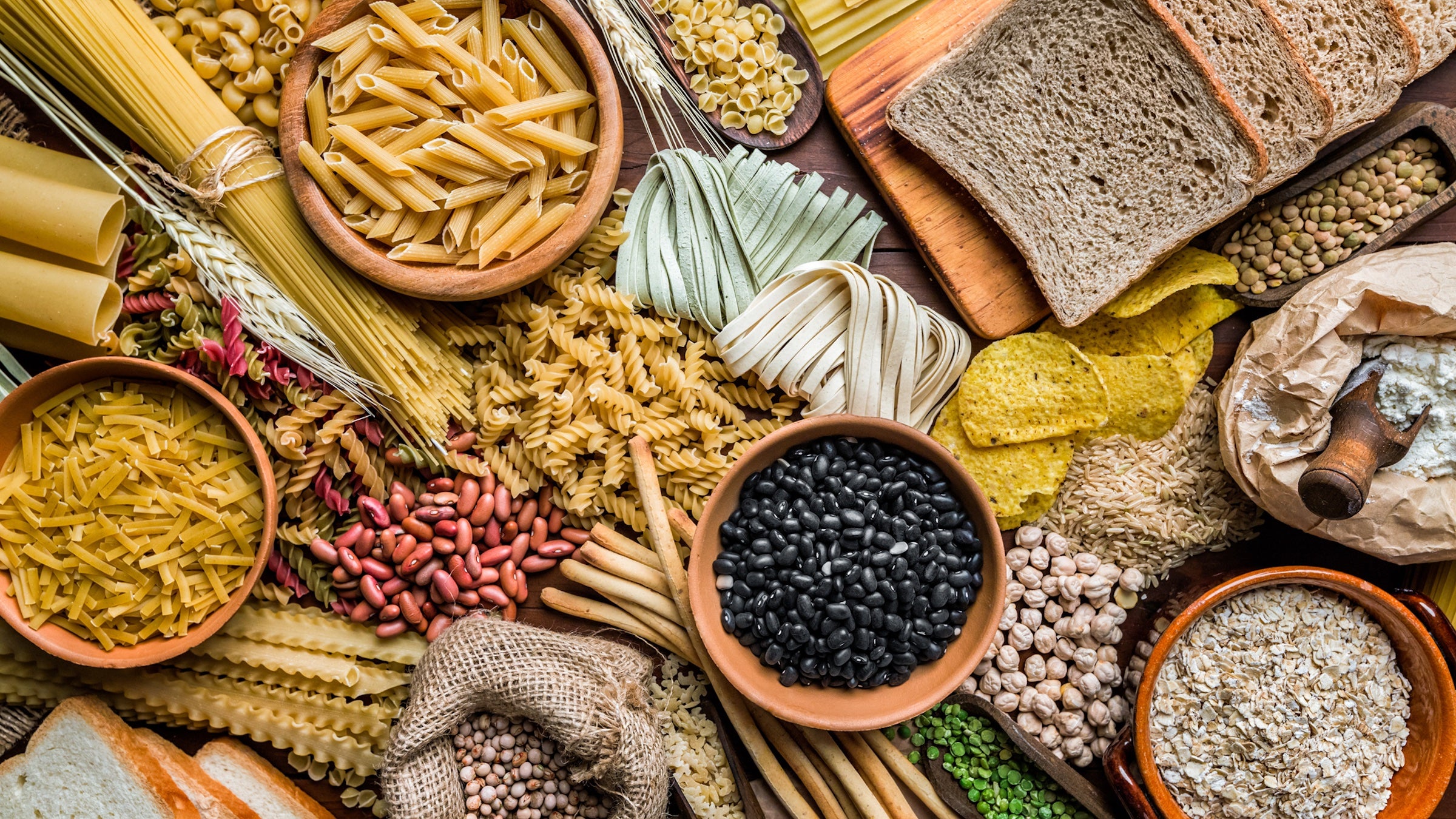 collage of beans, pasta, bread, and other carb-heaby foods