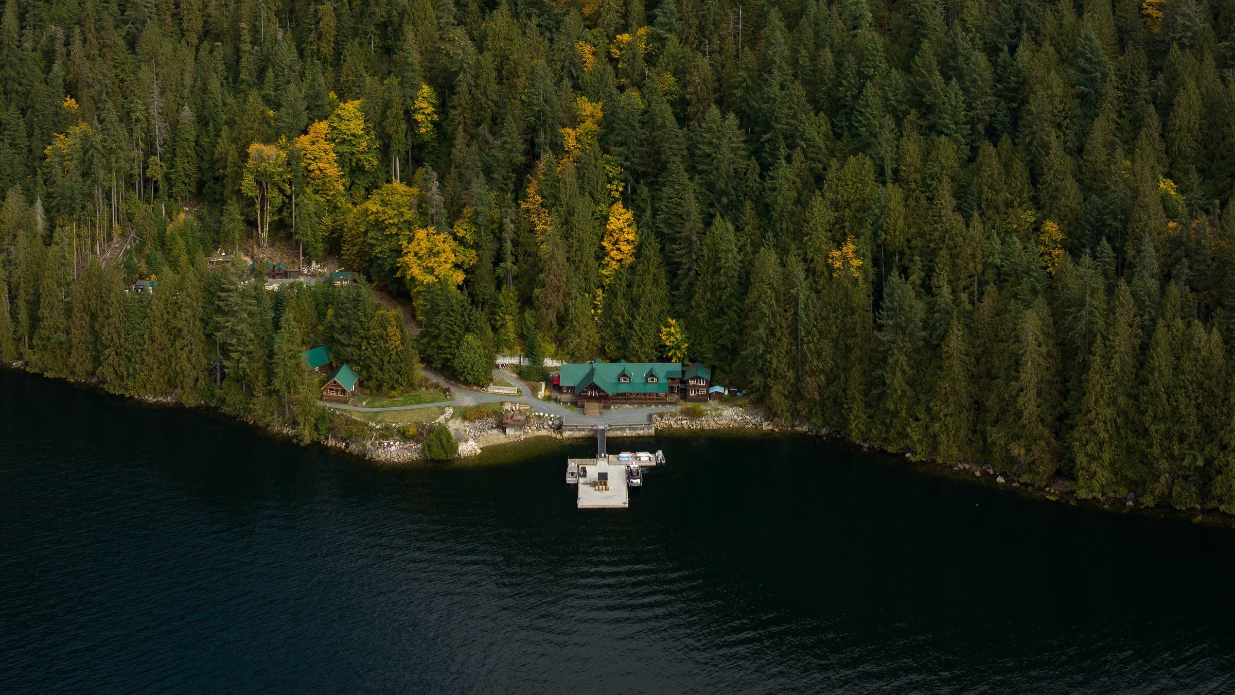 overhead shot of cabin on lake