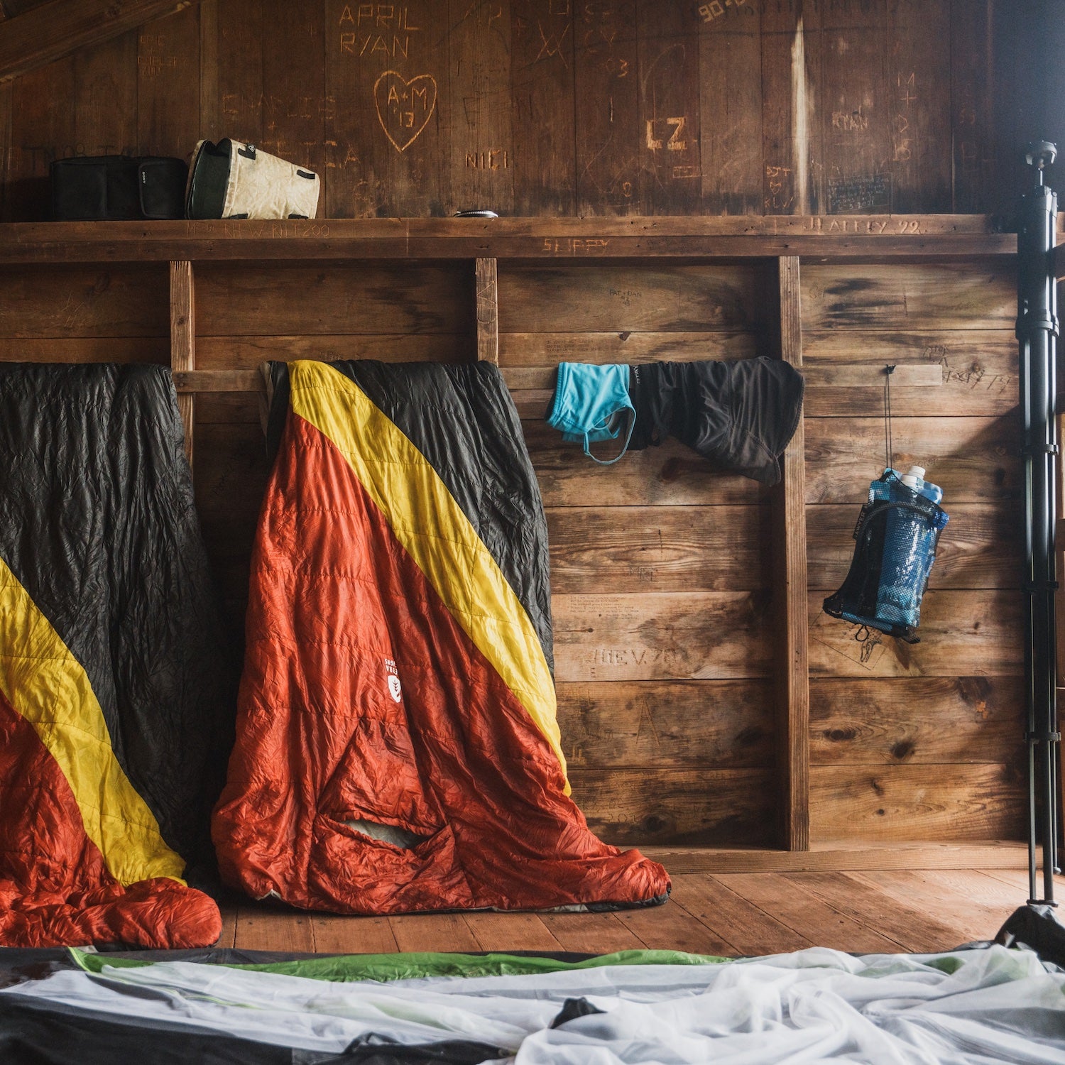 colorful sleeping bags in shelter