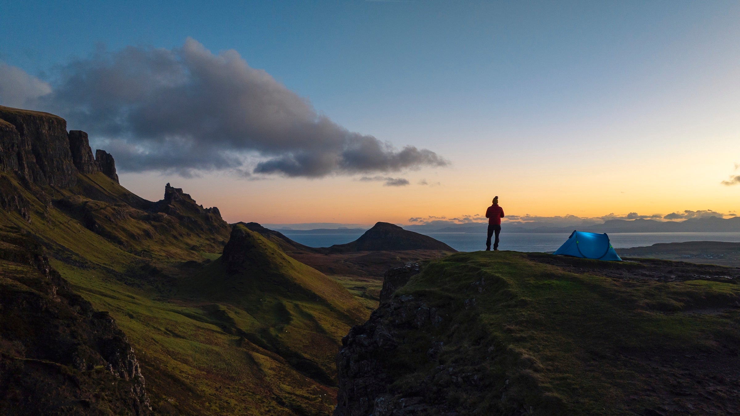 man standing in front of tent