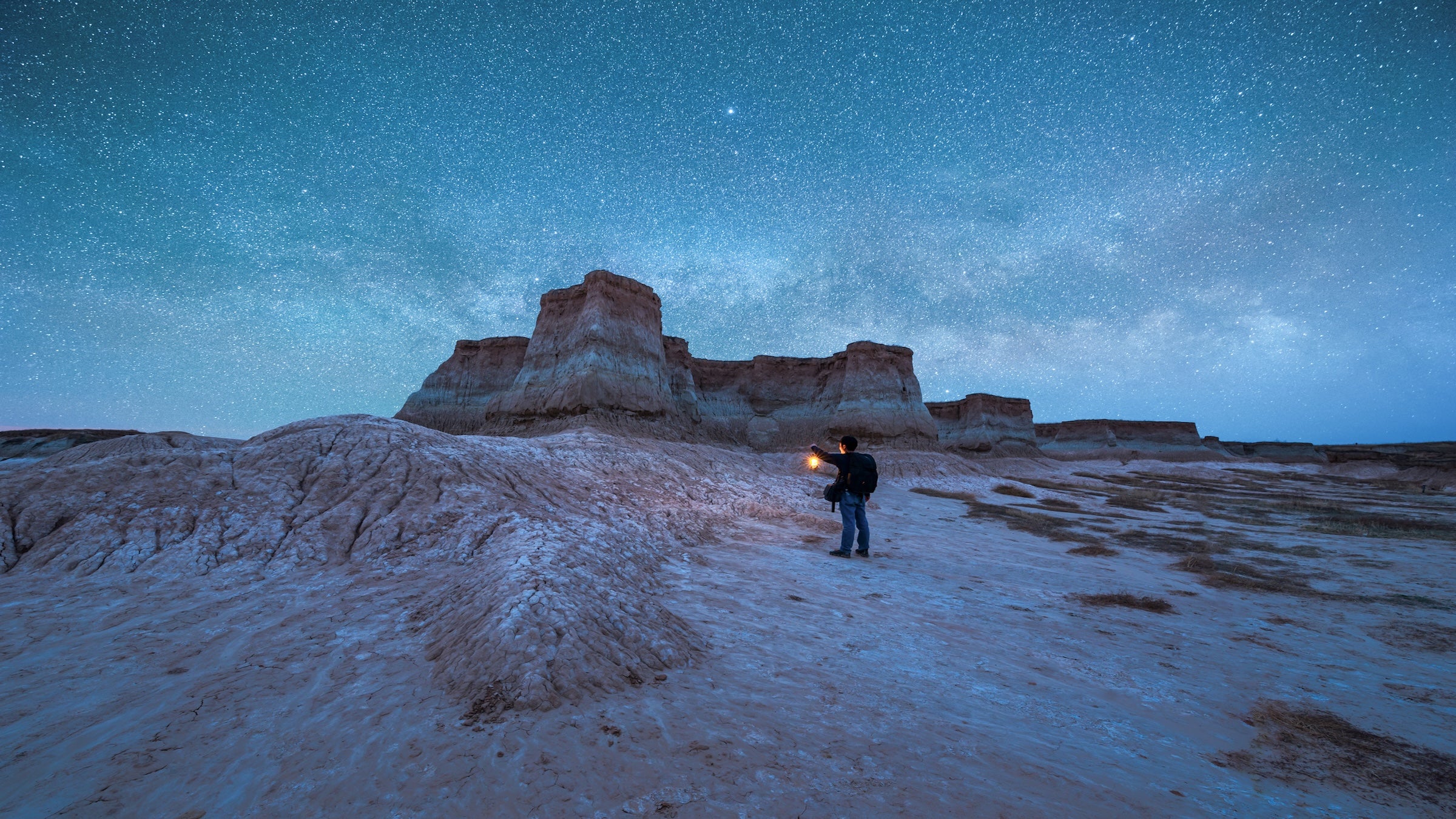 A traveler with a stirrup explores under the stars in Datong, Shanxi Province, China