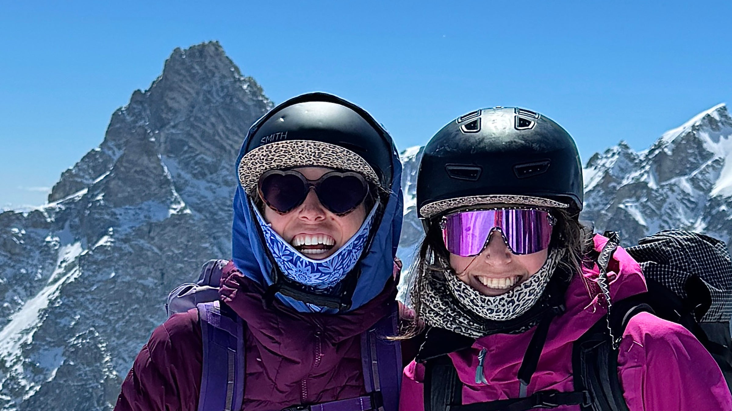 Two girls smile while wearing some of the best sunglasses we could find