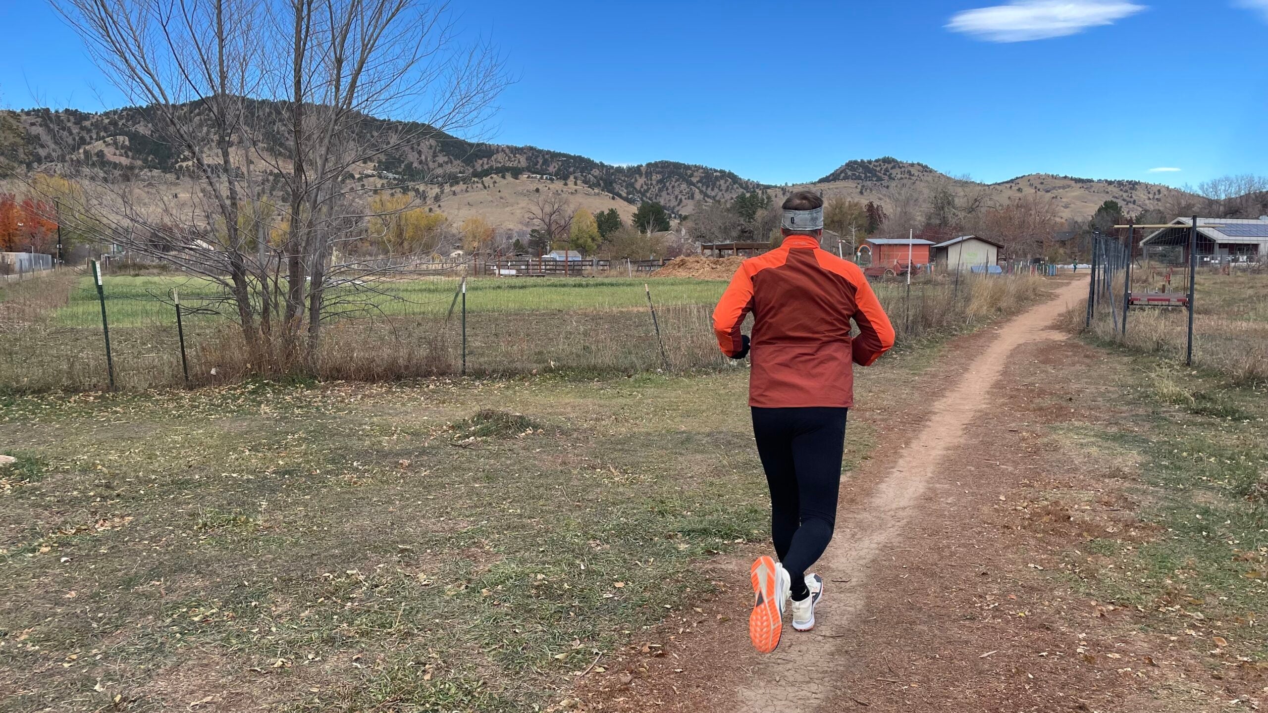 Running tester men's winter jackets on mountain trail