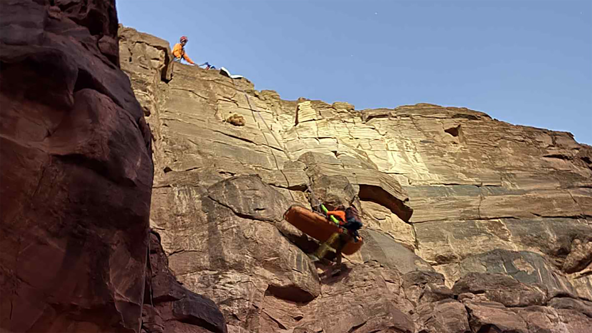 Rescue crews load the man's body onto a rescue litter