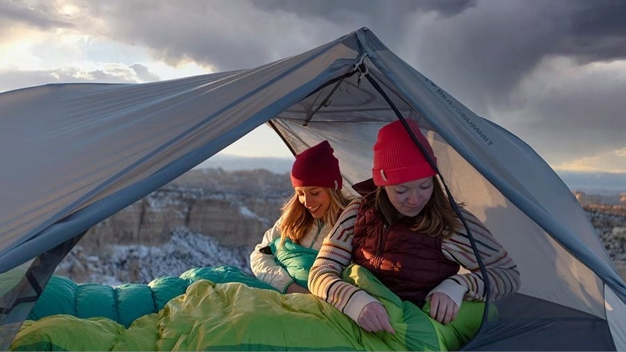 sea to summit telos tent with two women in it in the mountains