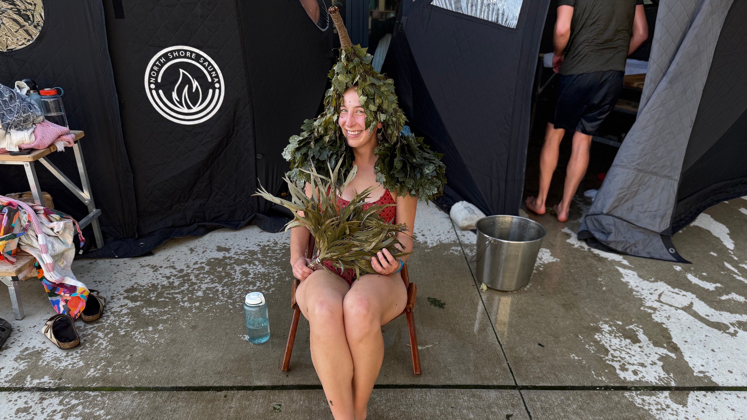 The author sitting with branches on her head