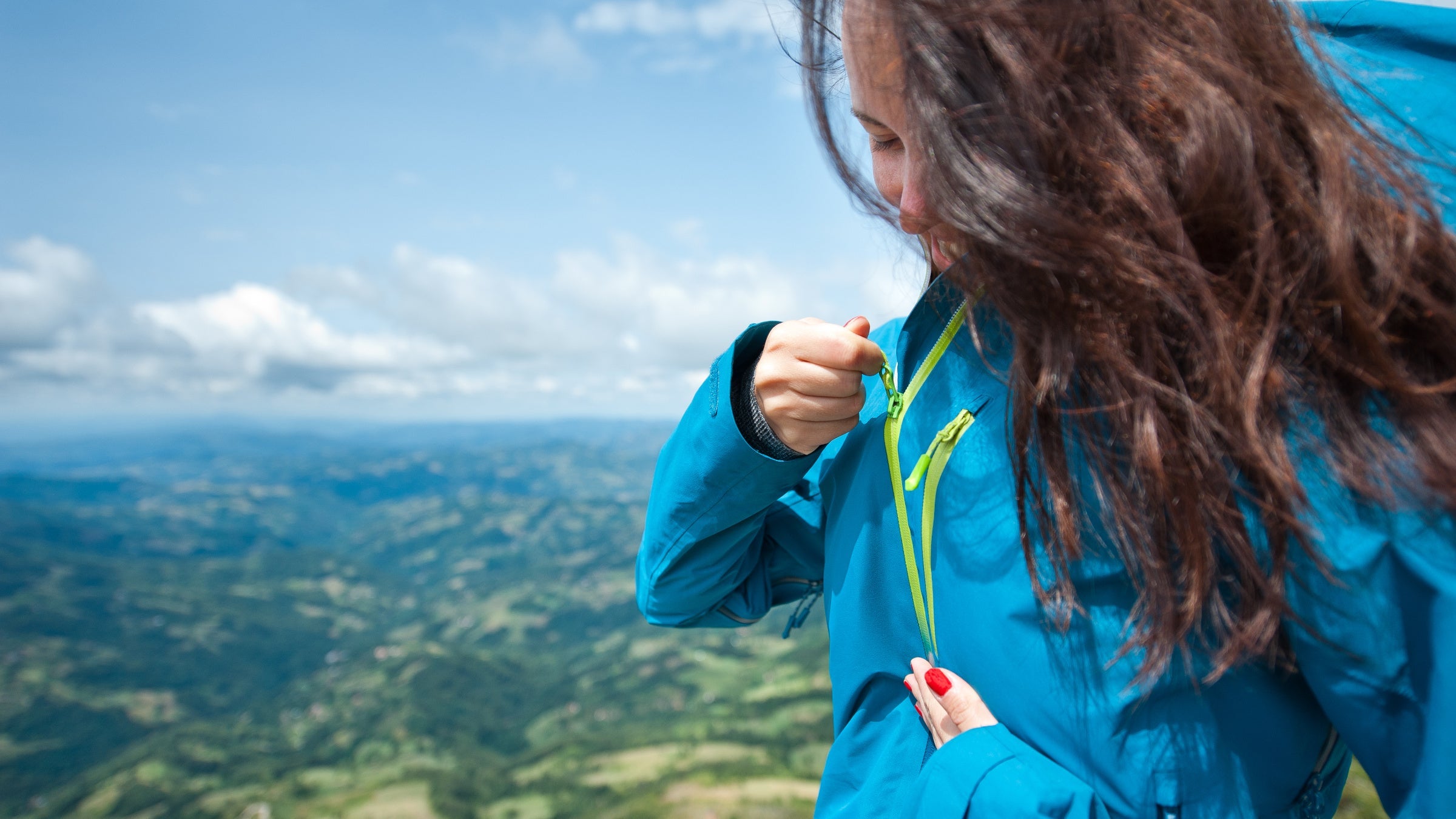 Hiker putting on a jacket