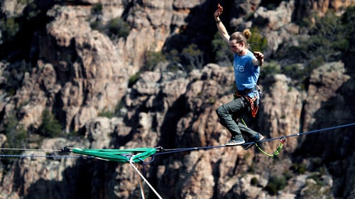 slacklining across a canyon to improve hand-eye coordination