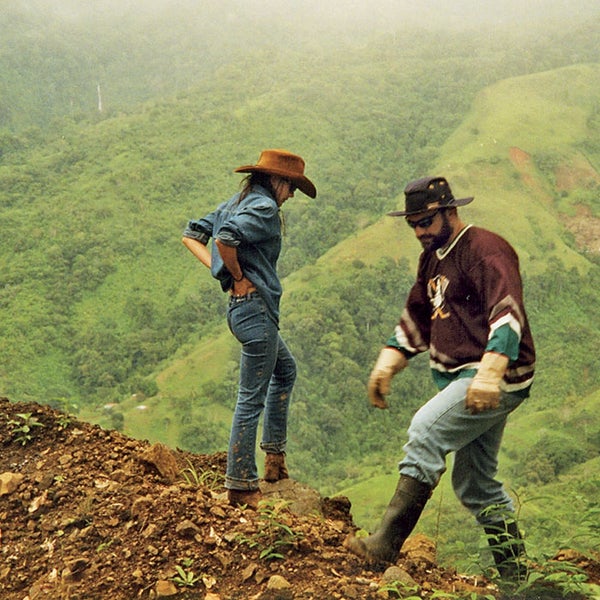 A brilliant American financier and his exotic wife build a lavish mansion in the jungles of Costa Rica, set up a wildlife preserve, and appear to slowly, steadily lose their minds. A spiral of handguns, angry locals, armed guards, uncut diamonds, abduction plots, and a bedroom blazing with 550 Tiffany lamps ends with a body and a compelling mystery: Did John Felix Bender die by his own hand? Or did Ann Bender kill him to escape their crumbling dream?
John and Ann inspecting road damage after a landslide. The couple weren't alone on Boracayan; they also hired teams of armed rangers, full-time animal caretakers, researchers and security guards.
Read the full story: Love and Madness In the Jungle