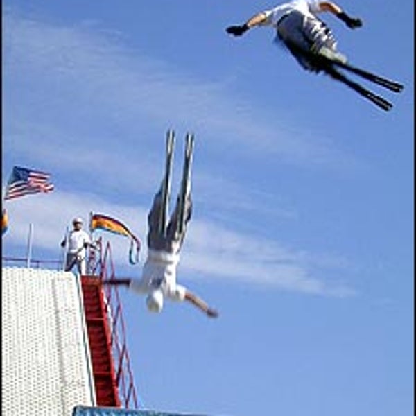 We don't need no stinkin' snow: Tommy DeAngelo and Lance Rouleau fly skyward after making jumps only seconds apart.