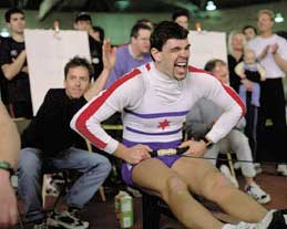 Chain man: Indoor rowing champ Matthias Siejkowski crosses the line.