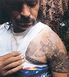 Swamp Thing: Bill Decosta displays his Egyptian pharoah hound tattoo. Boars are "nasty varmints," he says.