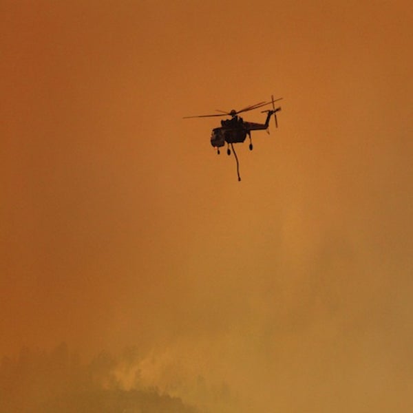 A heavy-lift helicopter makes a run to the Rio Grande for water.
