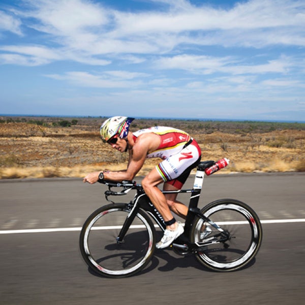 Alexander on his way to breaking the ironman world record; above, more race-day preparation.