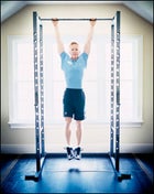 BODY BY PULL-UPS: Dr. Ben works out in his home gym.