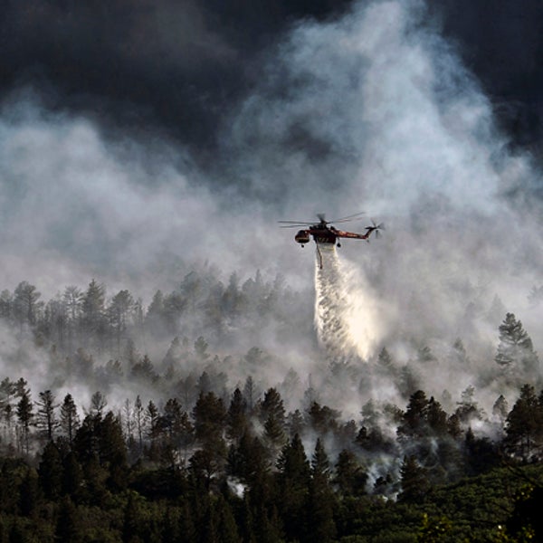Helicopter dropping water on the Waldo Canyon fire.