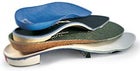 Standing room only: (from top) footbeds from Dr. Scholl's, Fastech, and Superfeet, and a custom orthotic