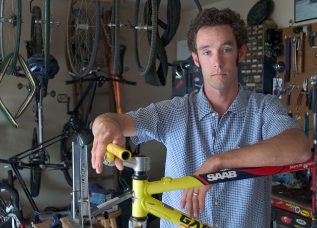 Mike Anderson is shown inside his garage and makeshift bicycle shop in 2005.