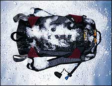 In an effort to keep your agua liquid longer, CAMELBAK lavishes foam insulation upon its compact SNOBOUND daypack. The company's standard drinking tube gains a neoprene sleeve, the swiveling bite valve gets a rubber shield, and half of the hose tucks into a body-warmed shoulder strap. The 1,500-cubic-inch pack will comfortably carry a snowboard or skisplus 100 ounces of water. The SnoBound is slow to frost over when worn during exertion, but take care not to stray too far from the lifts; with only part of the drinking tube tucked into the shoulder strap, this one could get frosty in a hurry. ($100; 800-767-8725, www.camelbak.com)