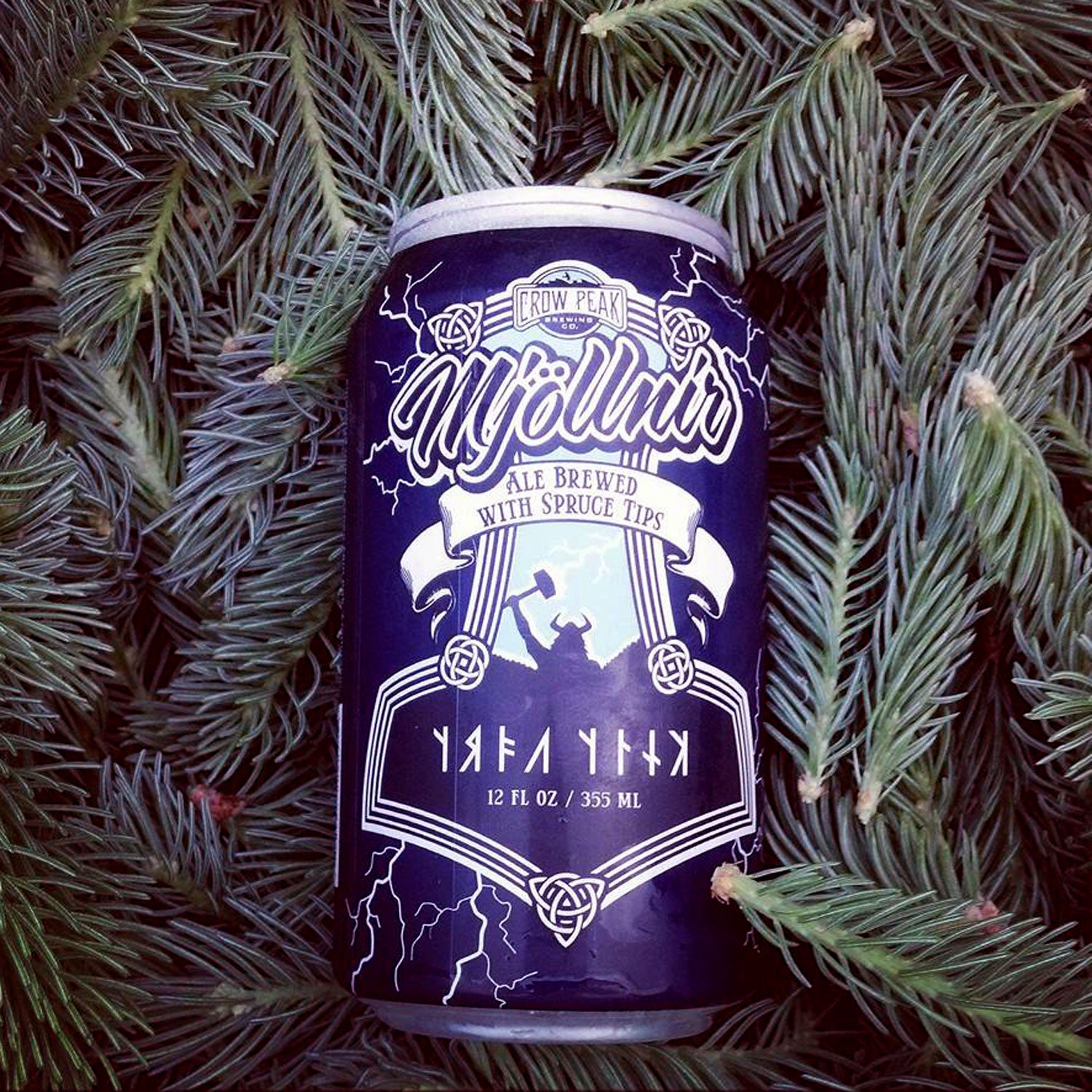 crow peak brewing mjollnir winter canned beer outside