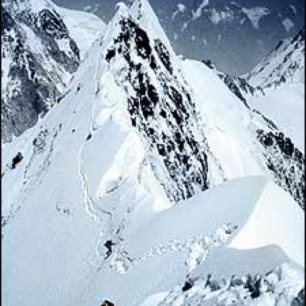 Don't look back; Rick Ridgeway, Foreground, and John Roskelley, members of the first American expedition to summit K2, ascend the northeast ridge in 1978.