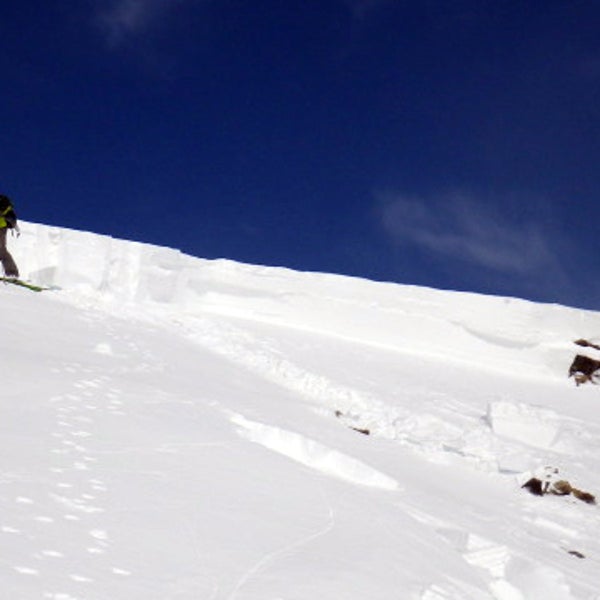 Tim Brown examines the crown face of the avalanche.