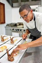 The chef prepares Peter Heller's lobster picnic.
