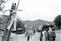 A cardboard effigy of Prime Minister Koirla hangs in the streets of Bhalubang in Rolpa district, one of several regions where the Maoist insurgency has taken hold.