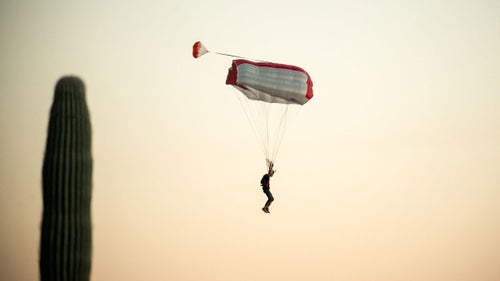 Aron Cohen comes in for a landing after a jump. In Arizona, the danger isn’t over until you’ve successfully navigated between the towering saguaro and the parachute-destroying cholla cacti.