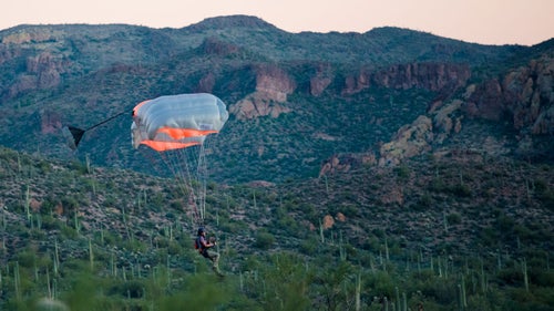 A female jumper lands on an old road below a jump from the Peralta cliffs. This popular jump is located near Gold Canyon, Arizona, which was the location of this year’s accuracy contest at the Arizona BASE Boogie.