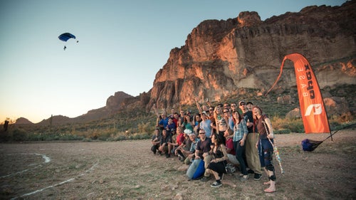 The event’s host, Matt Frohlich, has performed more than 1000 BASE jumps during the course of the past several years. A small landing target is painted in the dirt; jumpers try to hit the bulls eye.