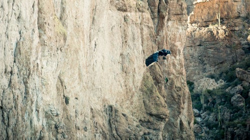 One of the most dangerous parts of jumping solid objects, such as cliffs, is the possibility that one’s parachute can open backward, causing the jumper to fly at the cliff. A 180, as it's called, can cause the parachute to snag and/or result in serious injury leaving the jumper dangling and helpless. In this photo James Yaru opened with a 180 but narrowly avoided the cliff as he managed to turn around with a couple feet to spare.
