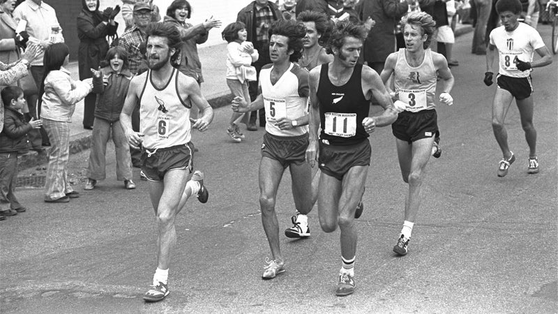 New Zealand's Kevin Ryan (center) looks over his shoulder as Bill Rodgers (right) makes his move to take the lead in the 1978 Boston Marathon as they pass through Natick, Massachusetts. At left is Frank Shorter.