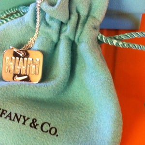 Your marathon medal's worth is usually mostly personal—at the Nike Women's (Half) Marathon, it's worth its weight in silver. Loot gear outside online swag goodies earn running race finish line winnings champions success finisher