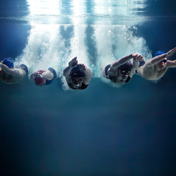 swimming athlete games water jump breathing Coordination energy bubble cap goggles speed win start women girl teen Competition Muscular Build Race Competitive Adult Swimwear Inhaling Horizontal training underwater bubbles dive deep pool sport swimmer exhale background isolated abstract blue cut out air profundity abyss group team five bpy professional together water