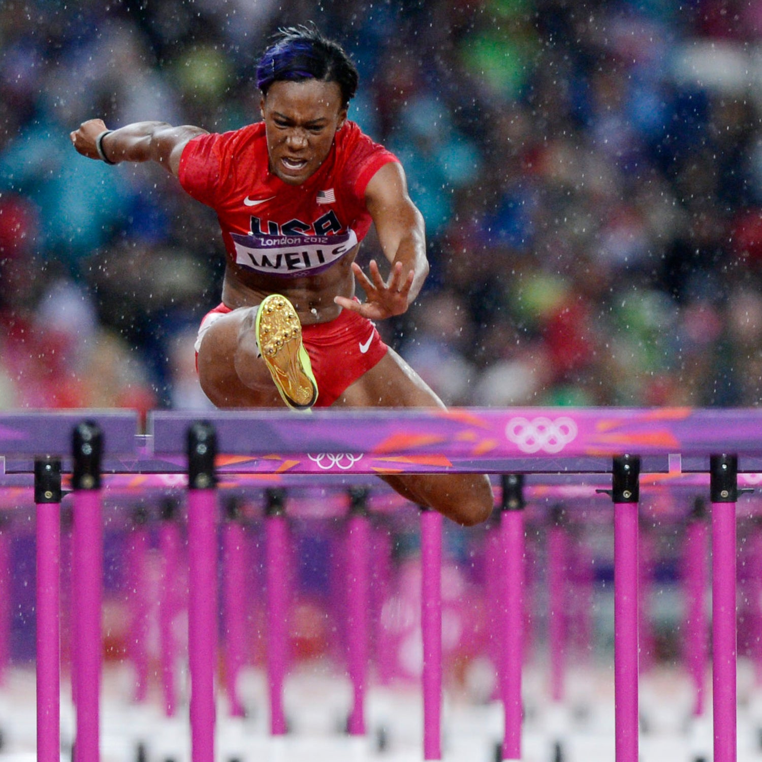 Aug 7, 2012; London, United Kingdom; Kellie Wells (USA), left, races Dawn Harper (USA), right, in the women's 100m hurdles final during the 2012 London Olympic Games at Olympic Stadium. Mandatory Credit: Robert Deutsch-USA TODAY Sports