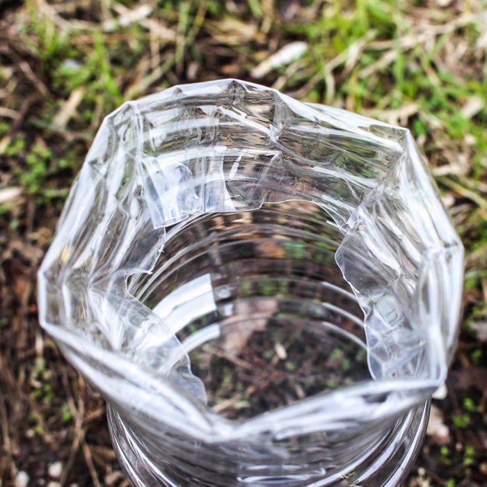 Staying hydrated should be among your top priorities after a disaster. (The average person can only survive two or three days without water.) Use an empty plastic bottle to filter water from plants, soil, or even mud, removing salts and heavy metals. Cut off the bottom of the bottle, then fold the bottle wall up a few inches into the interior. Next, place the mini still into a muddy puddle or pan of salt water and wait for the sun to do its work. Evaporated water will collect on the inside of the bottle, run down the sides and collect within the folded lip. When you've collected enough liquid, remove the lid and pour the distilled water into a clean container, or drink straight from the still.