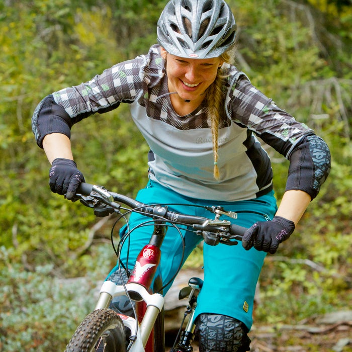 When you’re climbing or pedaling a smooth trail, you often want to stay in the saddle. But when you’re riding technical terrain, especially descending, stand on your pedals with a slight bend in your knees, waist, and elbows. It’s an athletic stance that helps absorb bumps in the trail. And it creates a frame to prevent you from getting pushed around in the process.