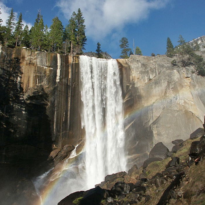 Best For: Getting Wet
On warm spring days, hiking the Mist Trail is a fun way to cool down. Starting at the footbridge, expect the spray of the falls to soak much of the trail.
Set off from the Happy Isles trailhead and continue past the John Muir Trail split. A line of more than 600 granite steps switchbacks up the rock face to the top of the falls. While the pools up there look inviting, several swimmers have been swept over the edge. Looking over the falls from the railings will make clear why a quick dip isn’t worth it.
Past Vernal, the trail continues to 594-foot Nevada Falls, another misty cataract. Rainbows in the spray make for dashing photos. To complete the loop, take the bridge back to the John Muir Trail before heading down.