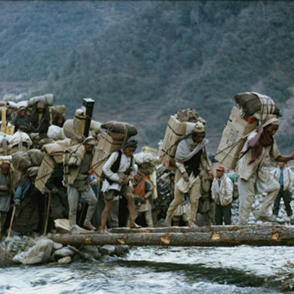 Men carry supplies to Everest Base Camp for the 1963 American team.