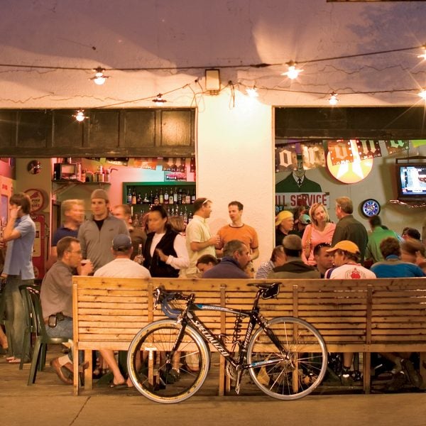 North America United States Idaho Boise lifestyle summer outdoors 30 somethings nightlife bicycles crowd party bar The Garage twilight festivity outside patio drinking gathering community celebration Cinco de Mayo Hyde Park neighborhood