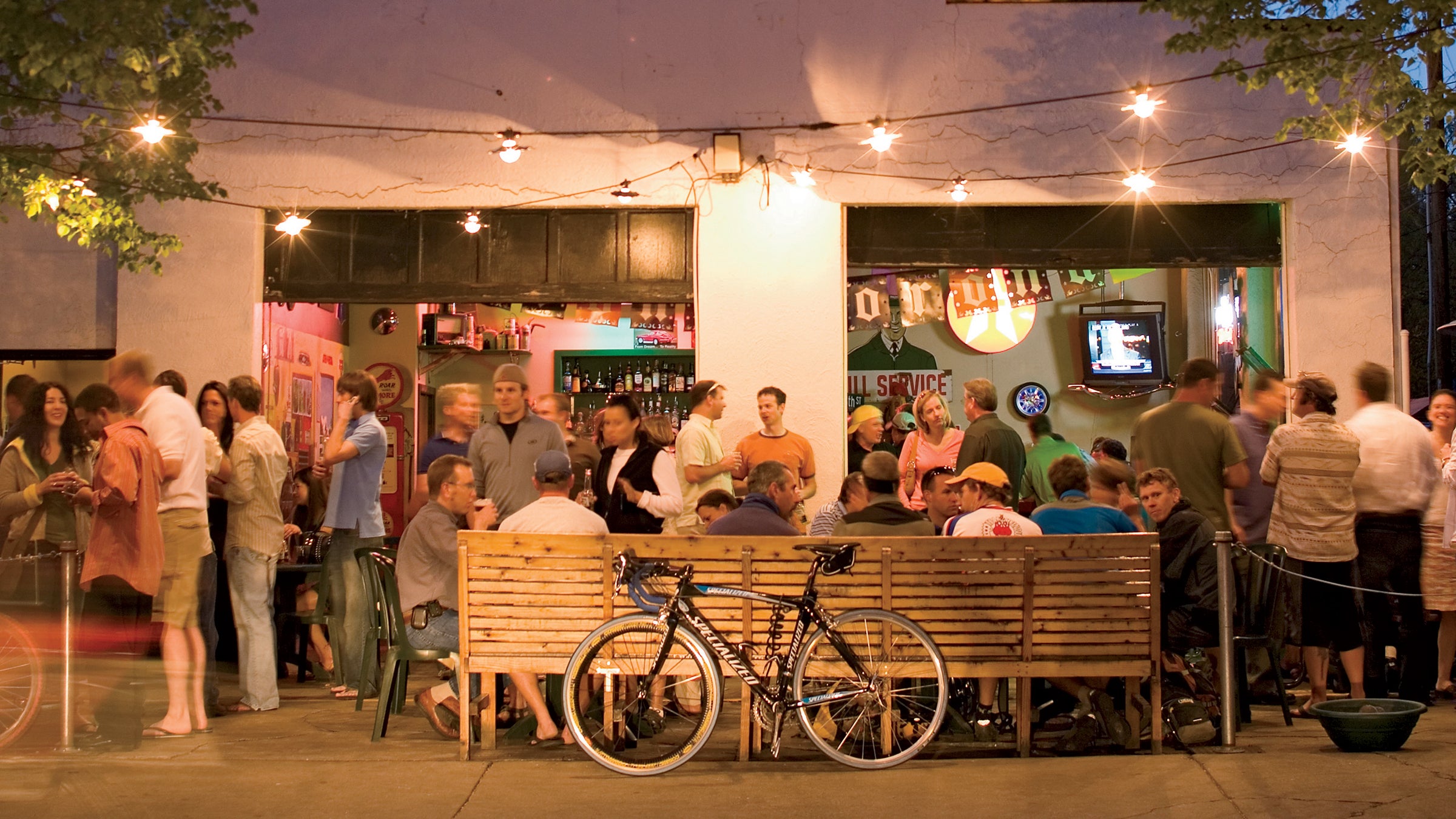 North America United States Idaho Boise lifestyle summer outdoors 30 somethings nightlife bicycles crowd party bar The Garage twilight festivity outside patio drinking gathering community celebration Cinco de Mayo Hyde Park neighborhood